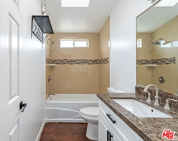 a bathroom with a sink and mirror