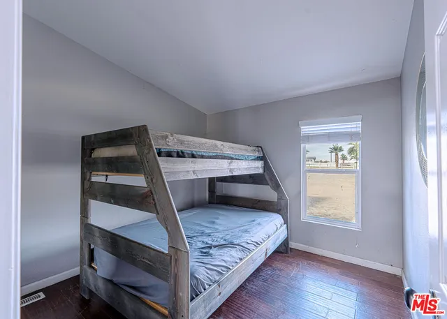 a bathroom with a sink a vanity and a mirror