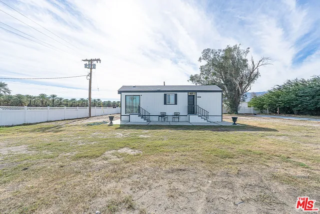 a view of a house with a big yard
