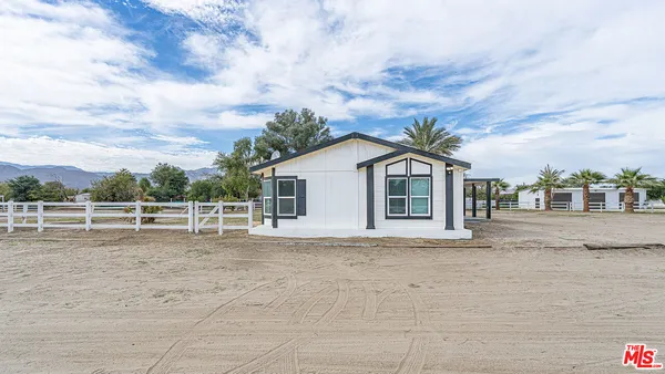 a vase of flowers sitting on a bathroom sink