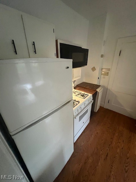 2915 Ludlow Road Cleveland, OH 44120 - Photo 20 of 50 Kitchen with white refrigerator, range, dark wood-style floors, and white cabinetry