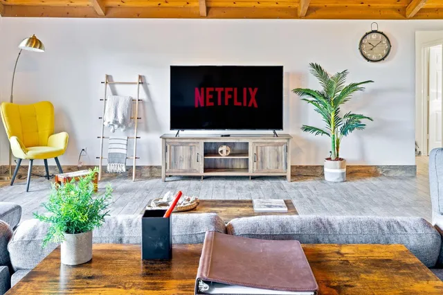 a living room with furniture and a flat screen tv