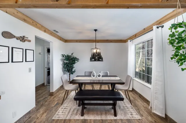 a view of a livingroom with furniture window and wooden floor