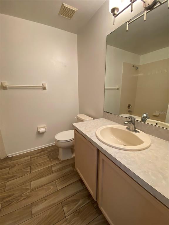 1258 Franford Drive Brandon, FL 33511 - Photo 12 of 20 a bathroom with a sink and mirror with toilet