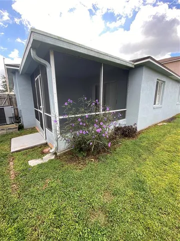 a view of an empty room with a large window