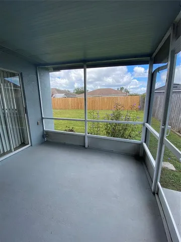 a view of a field with an ocean