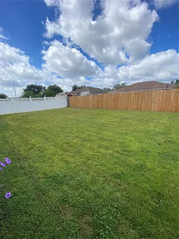 a view of a pathway with a yard