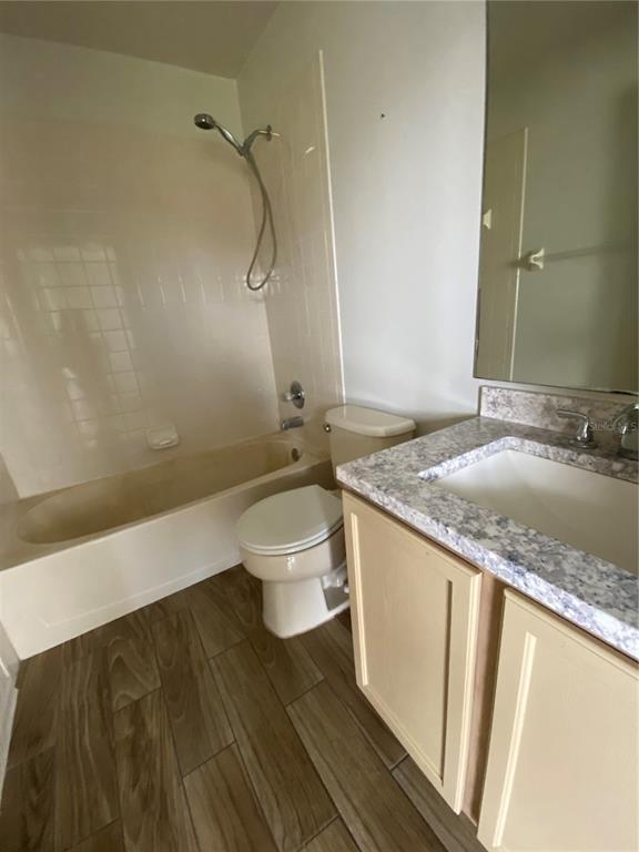 1258 Franford Drive Brandon, FL 33511 - Photo 10 of 20 a bathroom with a granite countertop sink toilet and shower