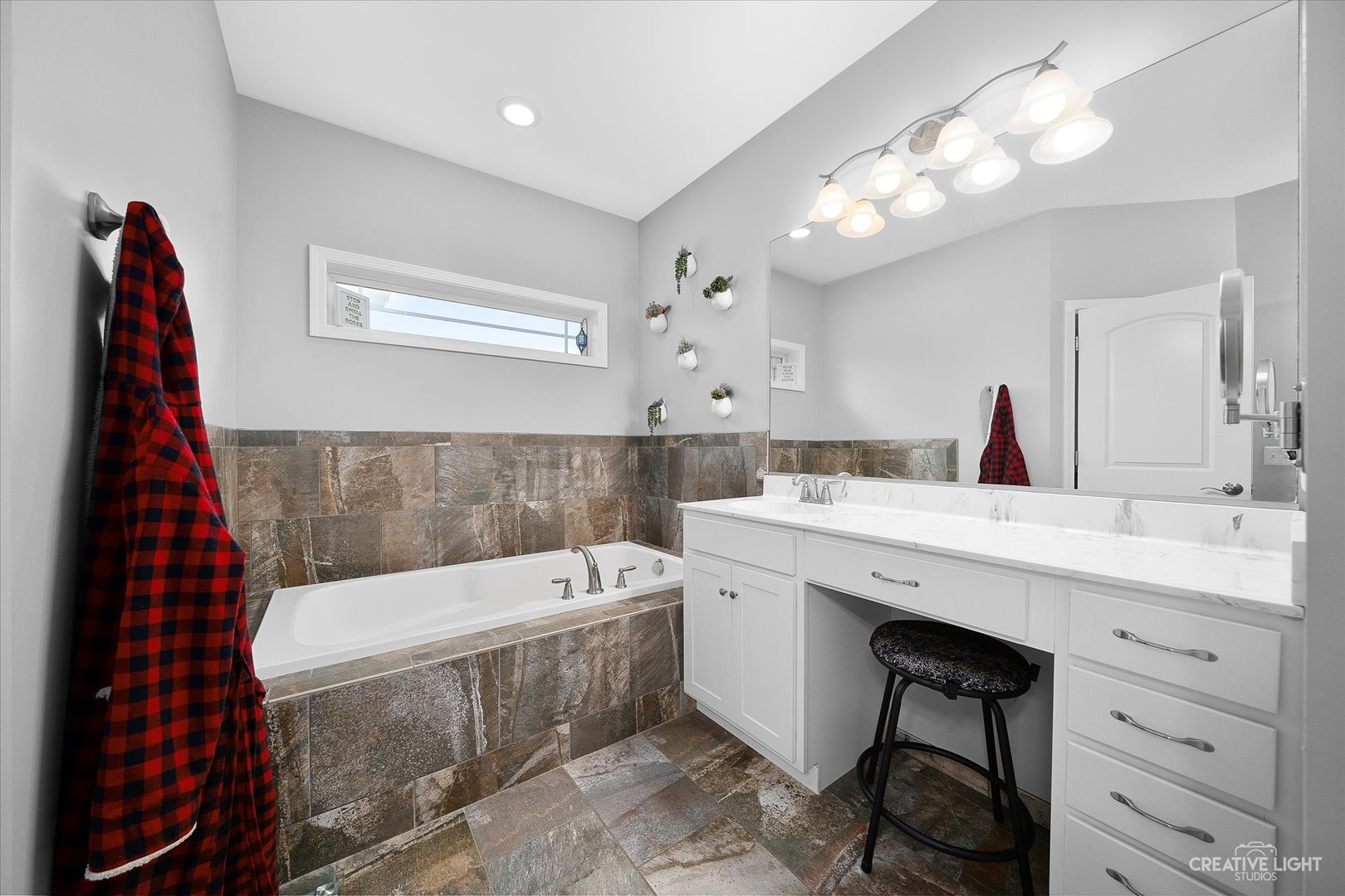 2969 4459th Road Newark, IL 60541 - Photo 14 of 35 a bathroom with a bathtub a sink and a mirror