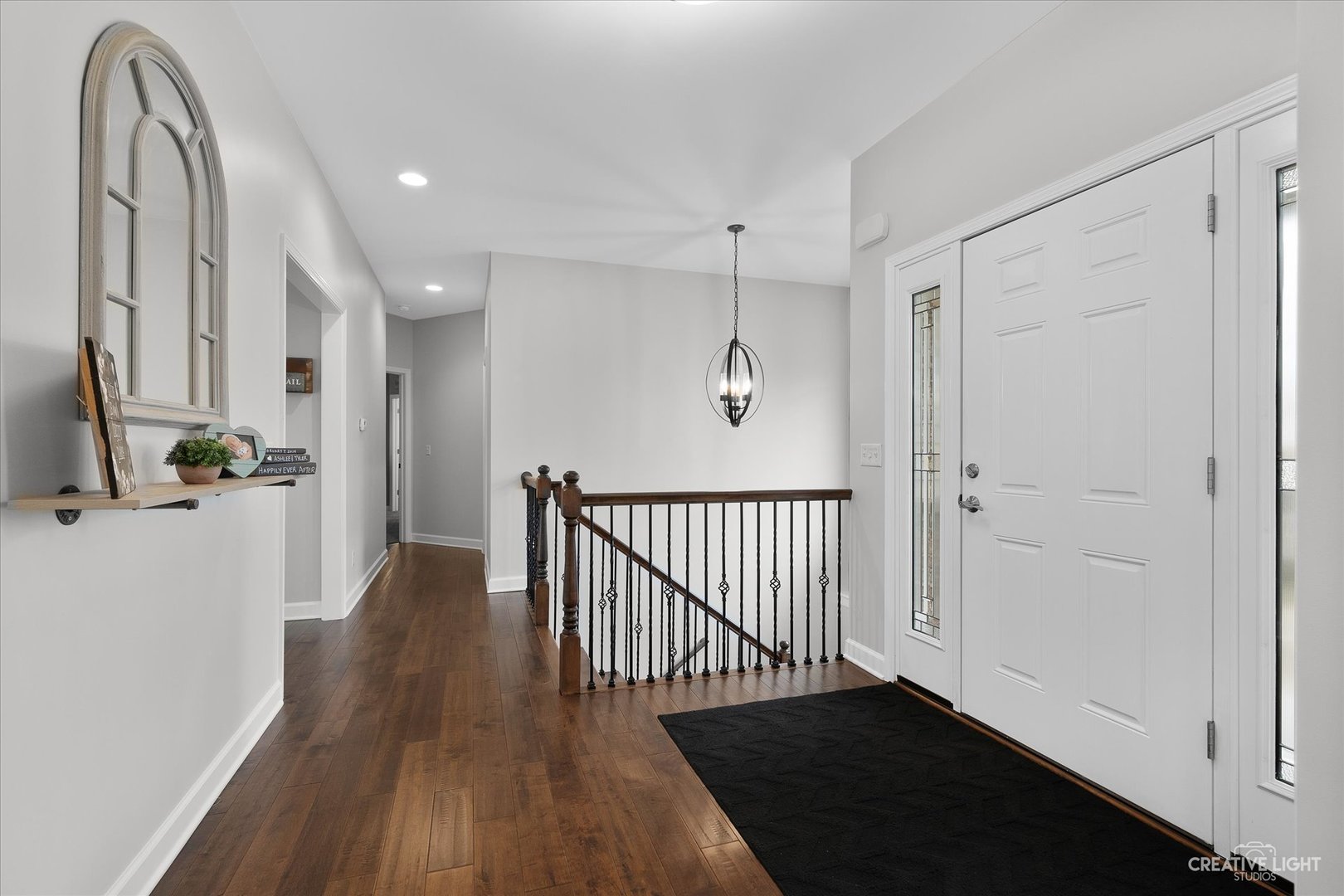 2969 4459th Road Newark, IL 60541 - Photo 8 of 35 a view of a hallway with wooden floor and staircase
