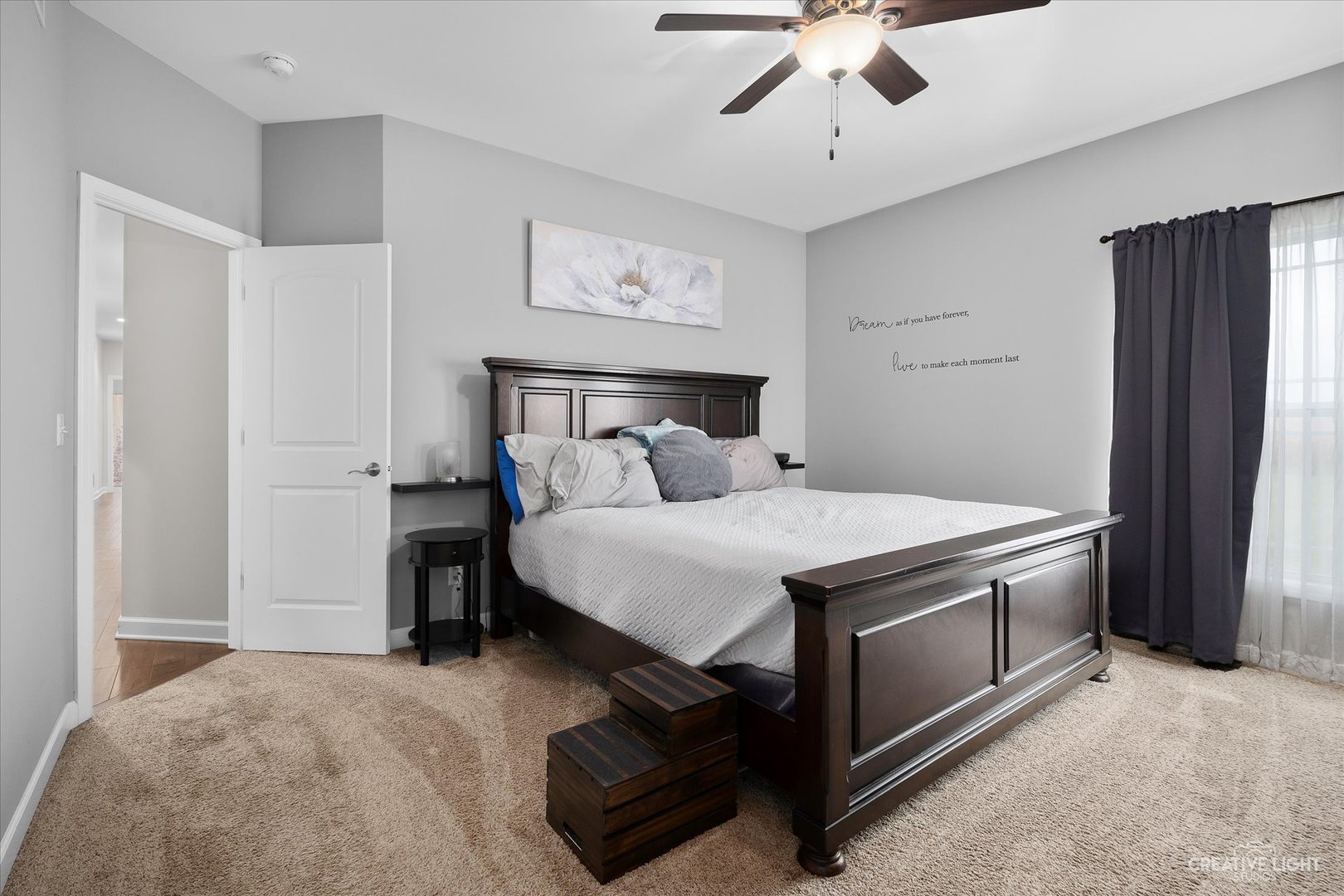 2969 4459th Road Newark, IL 60541 - Photo 9 of 35 a bed room with a bed and a chandelier