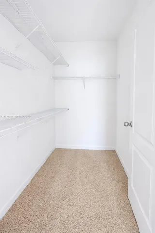 a white toilet sitting next to a bath tub