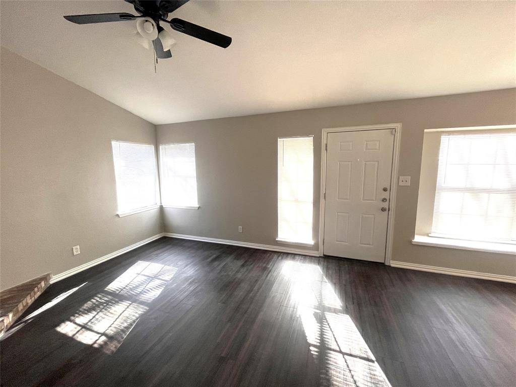 432 East Belt Line Road Cedar Hill, TX 75104 - Photo 18 of 30 a view of an empty room with wooden floor and a window