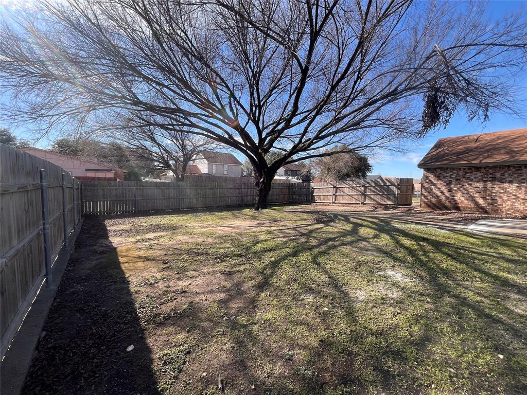 432 East Belt Line Road Cedar Hill, TX 75104 - Photo 28 of 30 a view of a yard with wooden fence