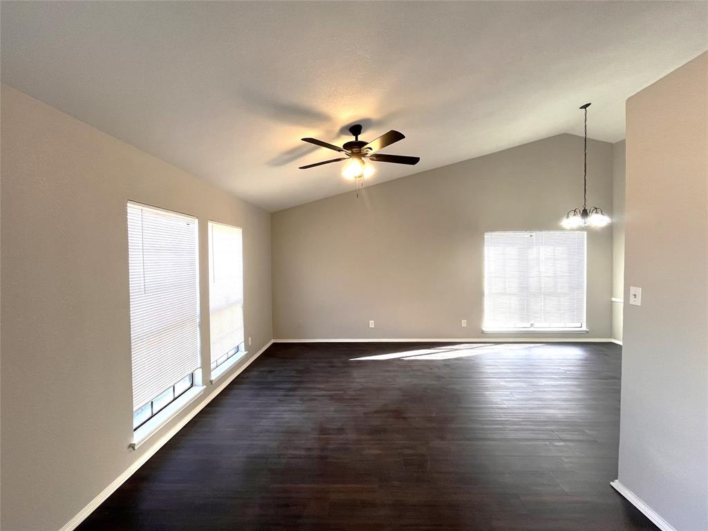 432 East Belt Line Road Cedar Hill, TX 75104 - Photo 3 of 30 a view of an empty room with window and wooden floor