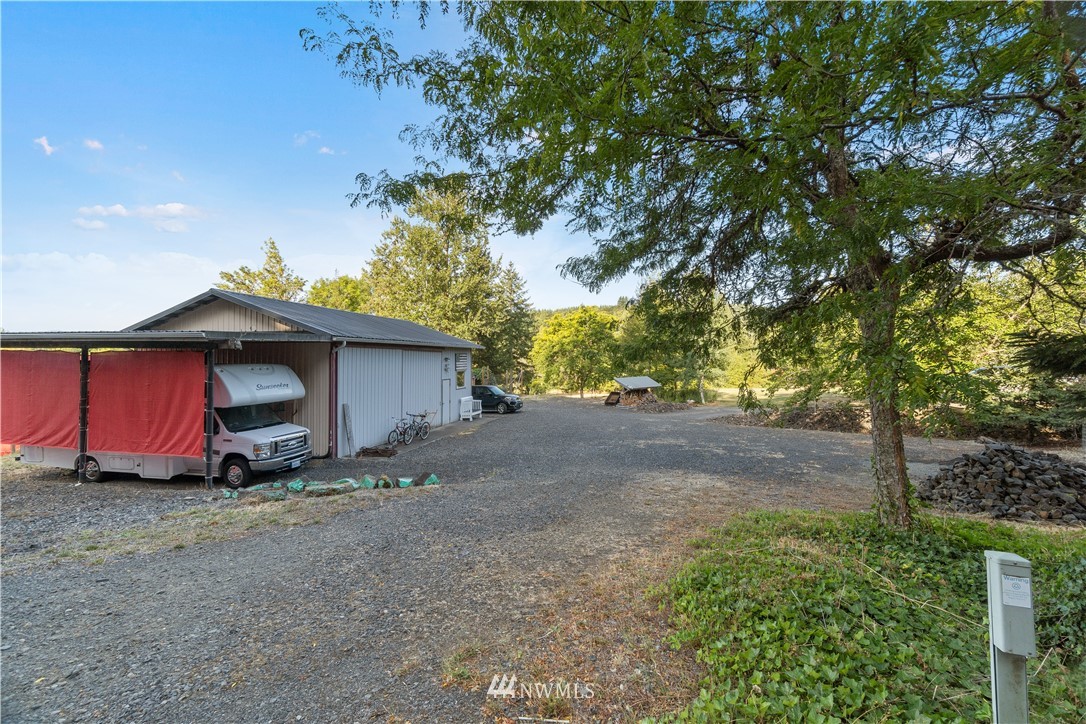 199 Jeffries Road Chehalis, WA 98532 - Photo 35 of 40 a view of a house with a yard and garage