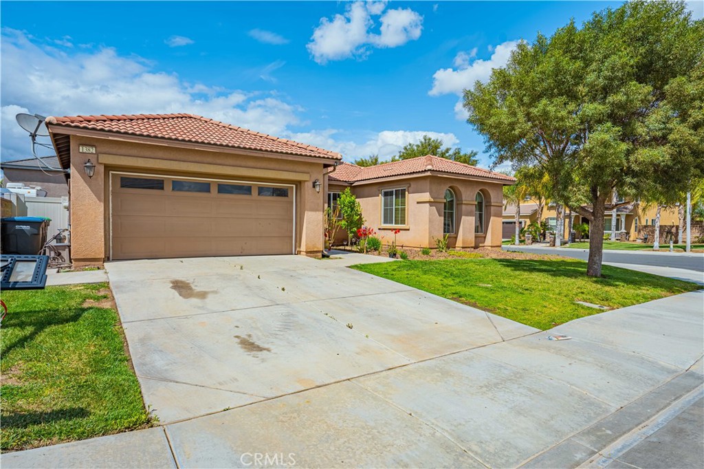 1382 Sunset Avenue Perris, CA 92571 - Photo 1 of 1 a front view of house with yard