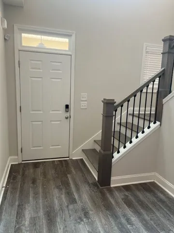 a view of entryway with wooden floor