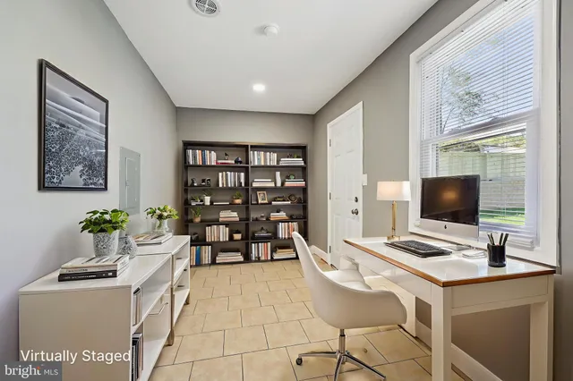 a work place with furniture and window