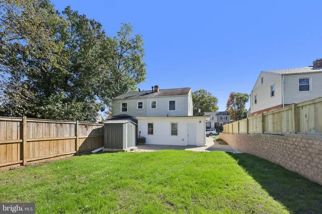 a view of backyard with small cabin