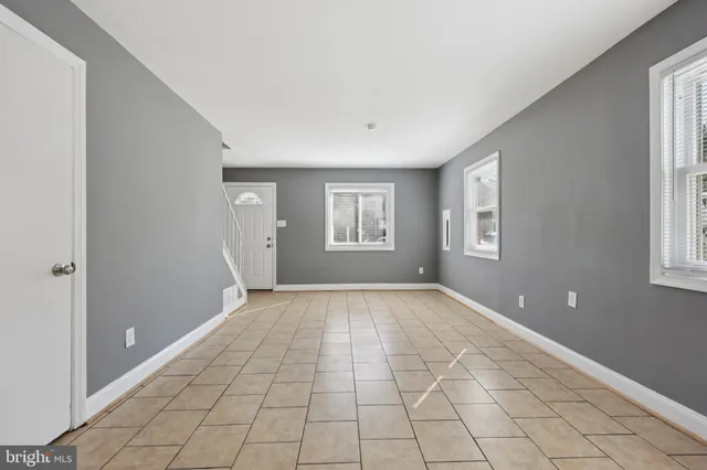 a view of an empty room with windows