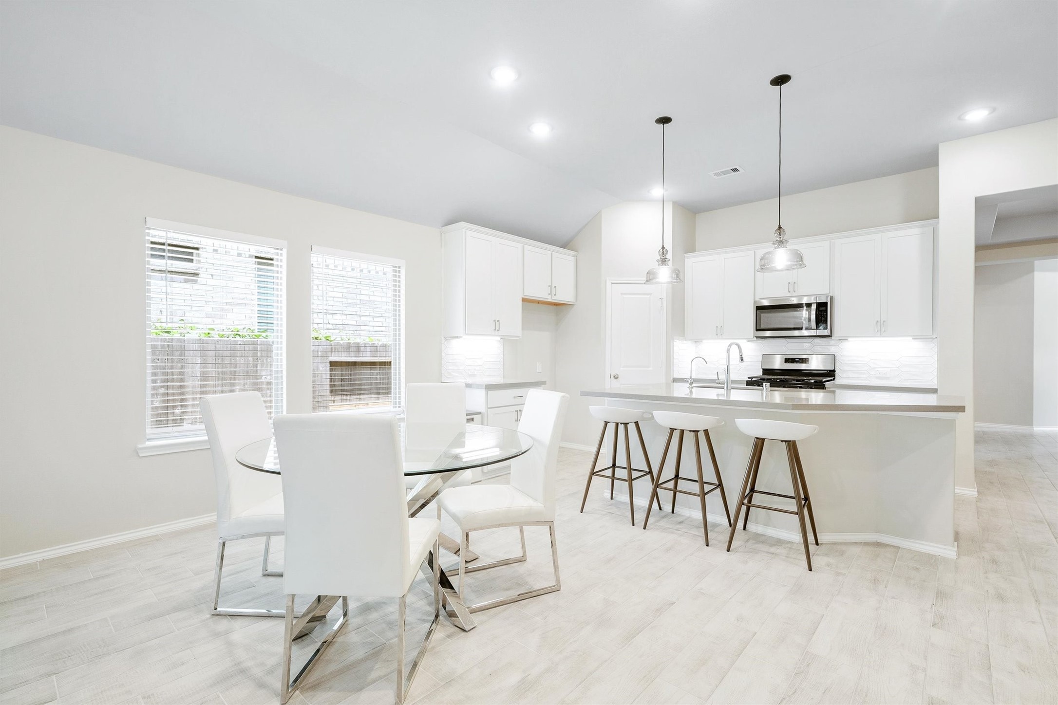 17270 Wild Watermelon Way Conroe, TX 77302 - Photo 11 of 28 Dining and cooking in perfect harmony. The casual dining area flows directly into the kitchen. This layout was made for people who love to gather.