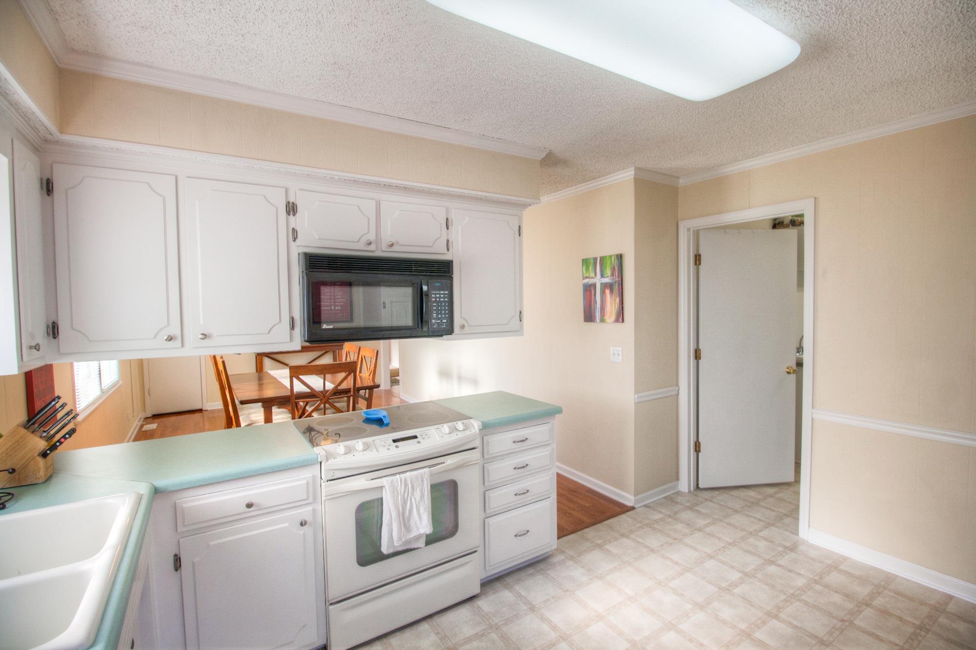4509 Baton Rouge Drive Hermitage, TN 37076 - Photo 11 of 30 a kitchen with stainless steel appliances granite countertop a sink stove and cabinets