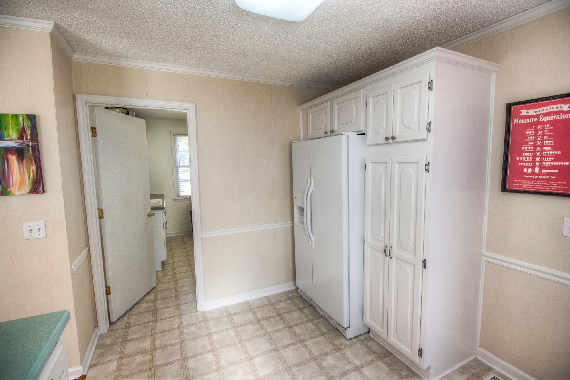 4509 Baton Rouge Drive Hermitage, TN 37076 - Photo 12 of 30 a view of a hallway with wooden floor and a cabinet