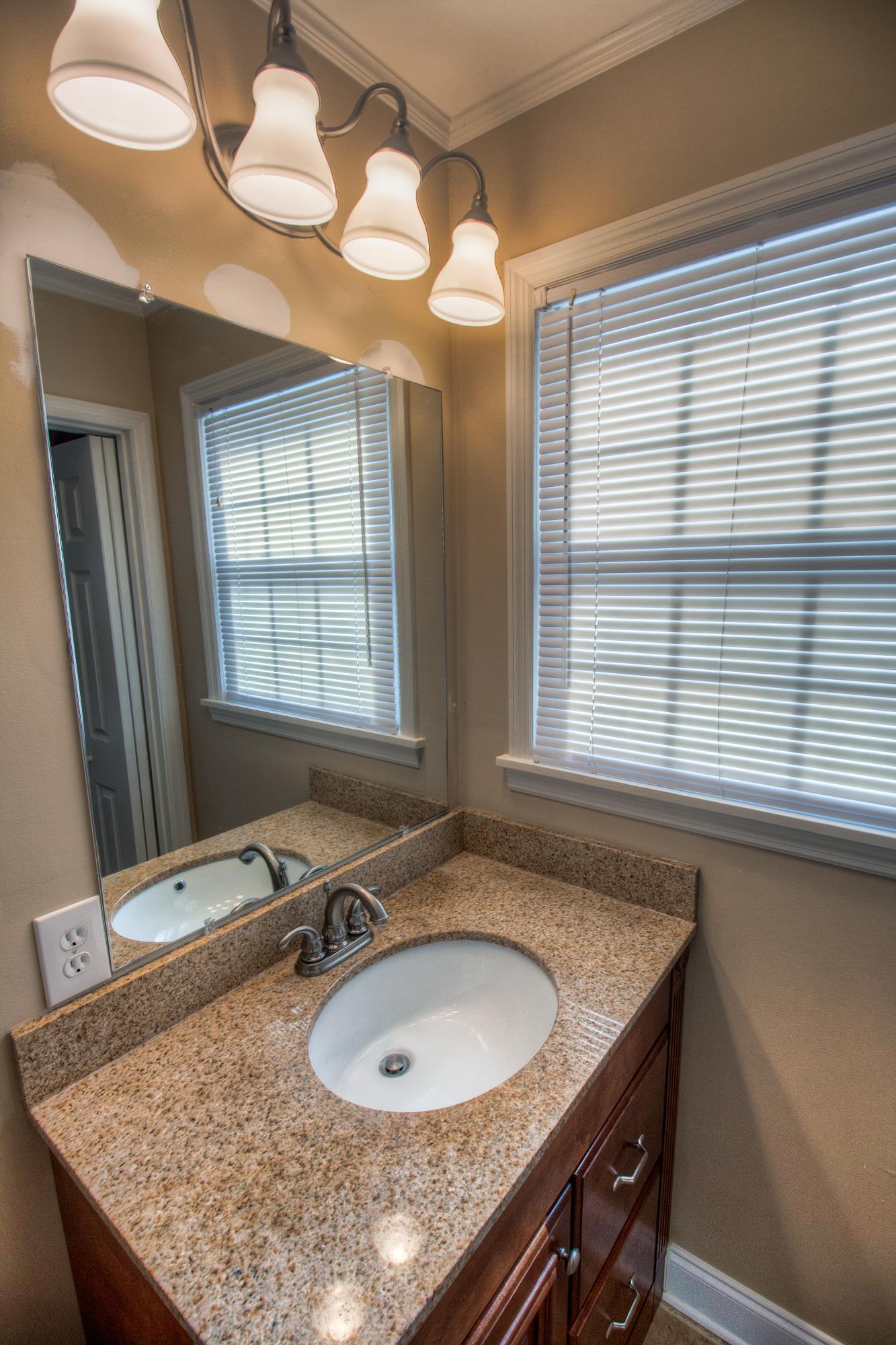4509 Baton Rouge Drive Hermitage, TN 37076 - Photo 18 of 30 a bathroom with a granite countertop sink and a mirror