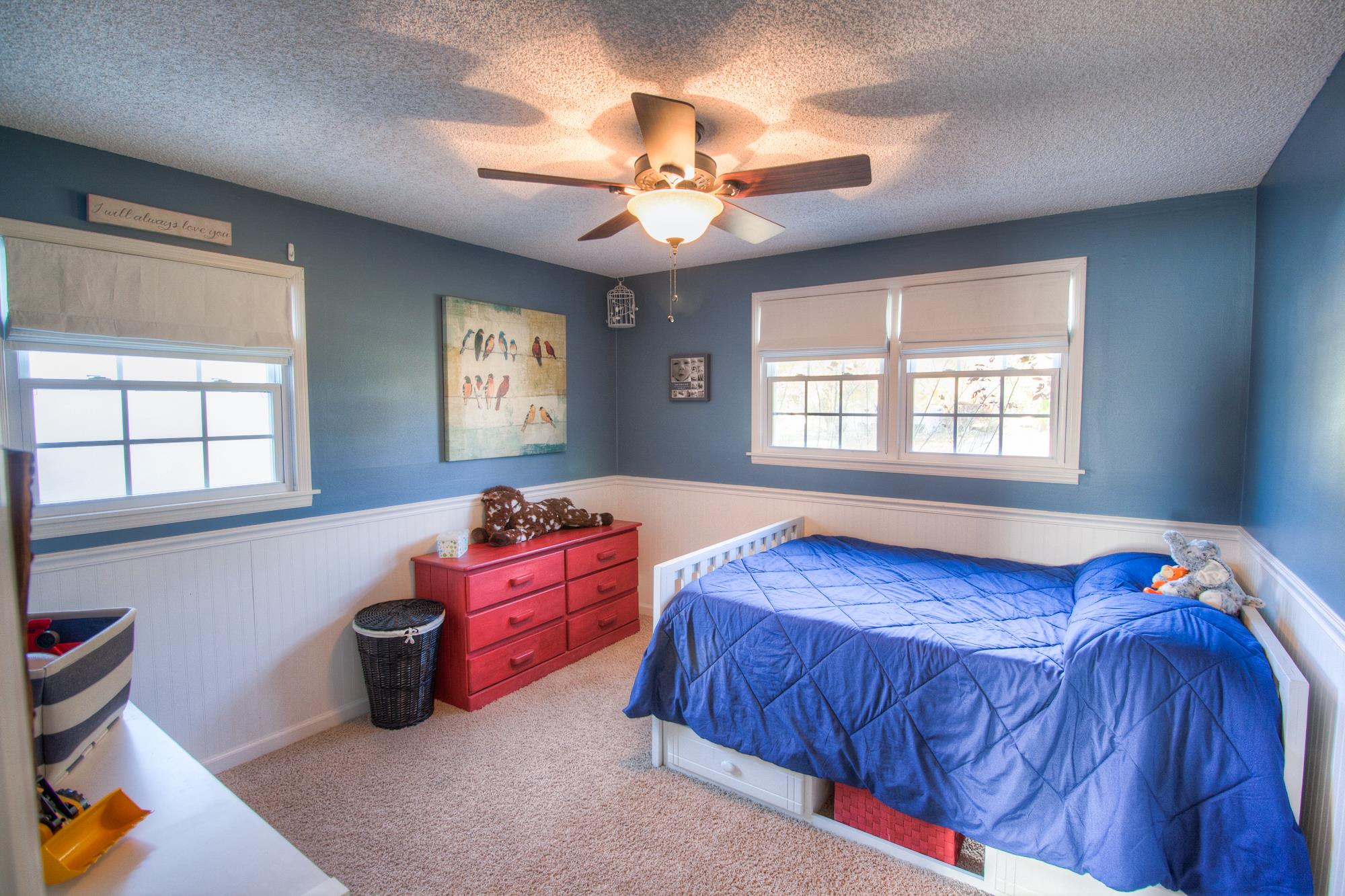 4509 Baton Rouge Drive Hermitage, TN 37076 - Photo 19 of 30 a bedroom with a bed and a chandelier