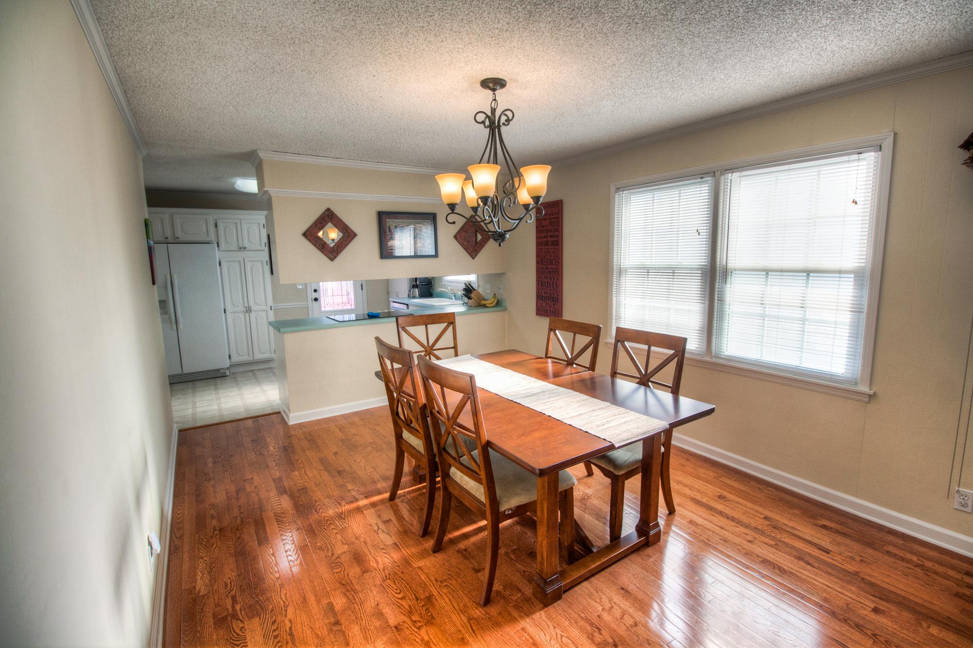 4509 Baton Rouge Drive Hermitage, TN 37076 - Photo 7 of 30 a view of a dining room with furniture a chandelier and wooden floor