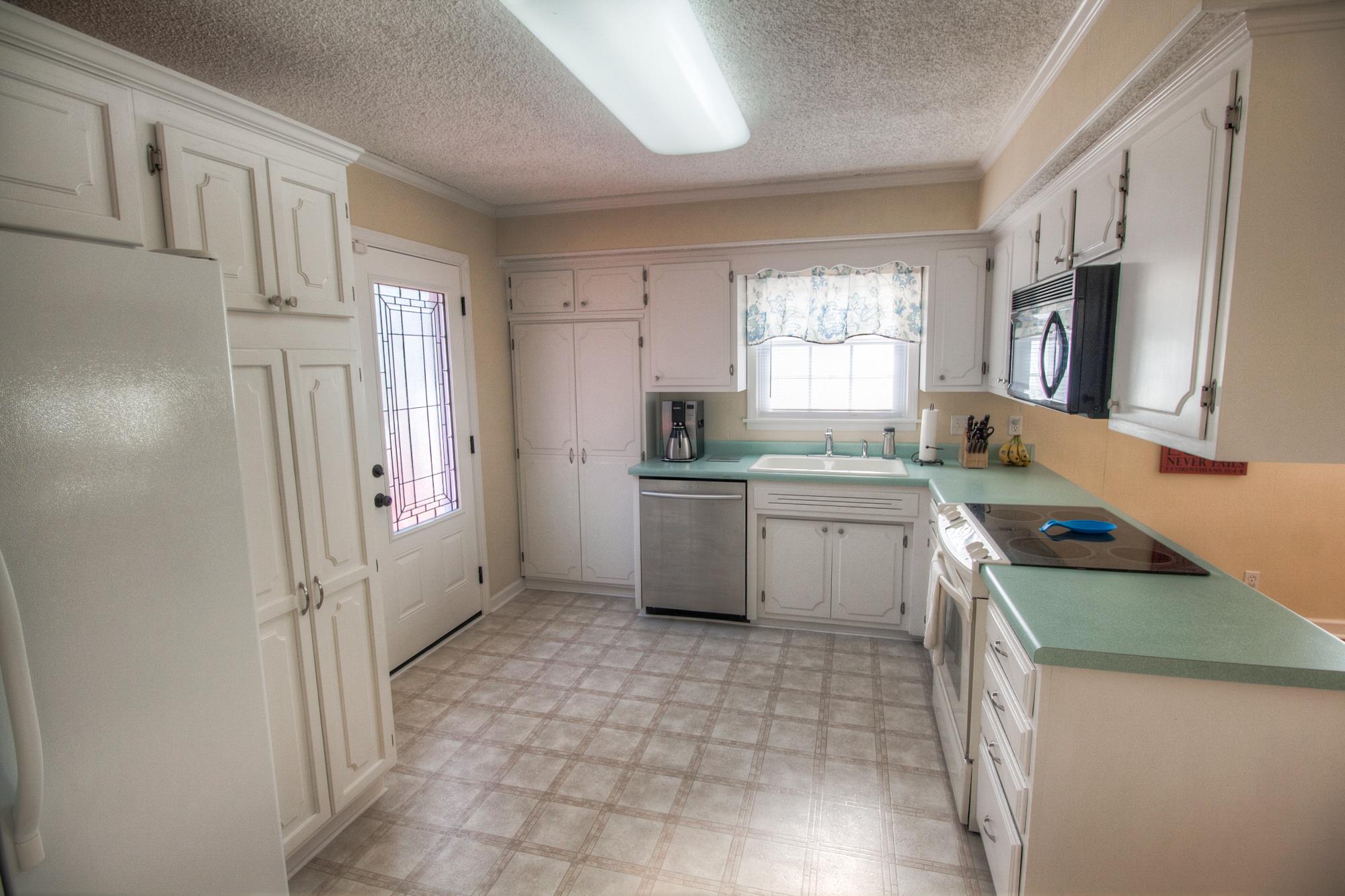 4509 Baton Rouge Drive Hermitage, TN 37076 - Photo 10 of 30 a kitchen with a stove a sink and a refrigerator