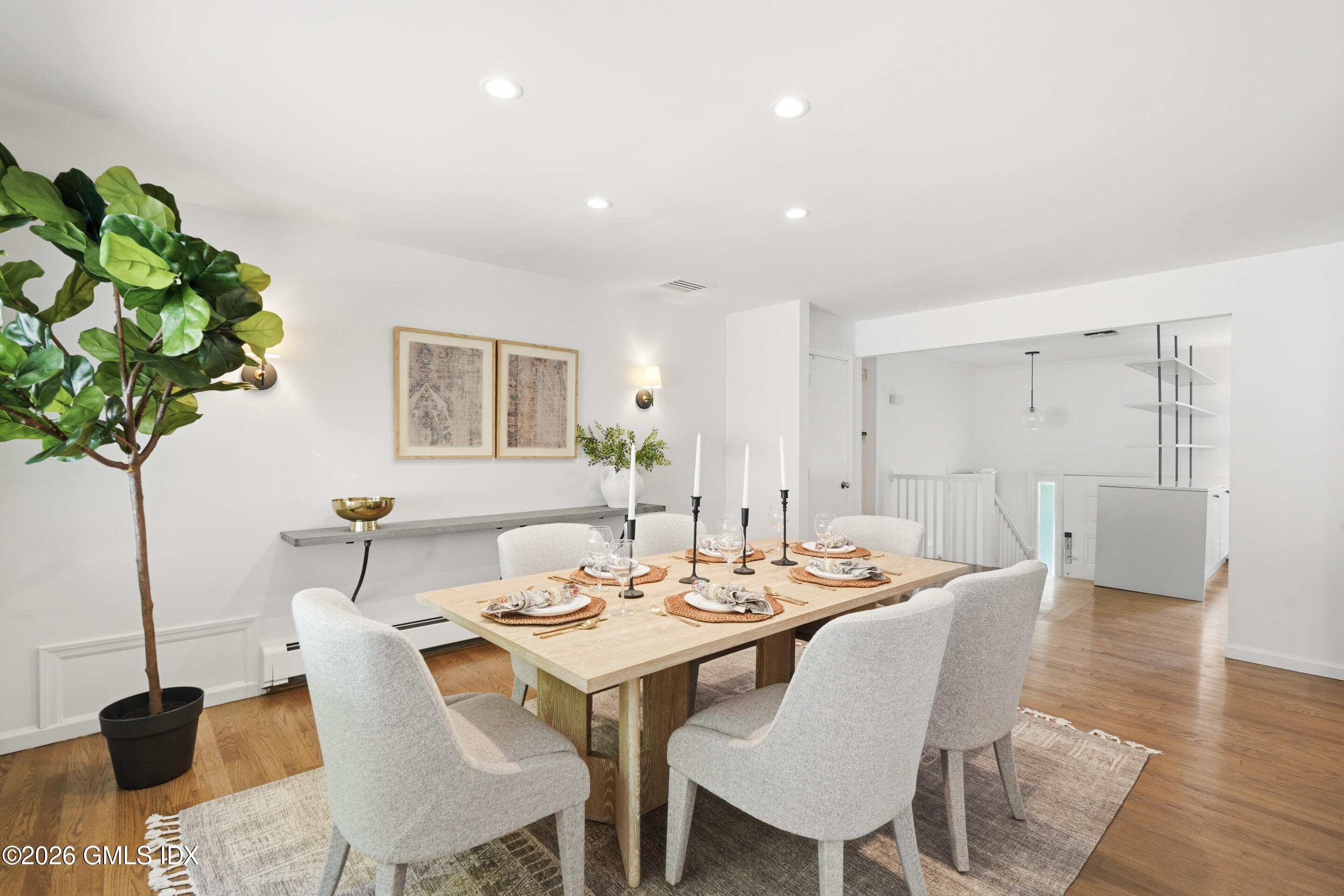 33 Sachem Road Greenwich, CT 06830 - Photo 9 of 35 a dining room with furniture and wooden floor