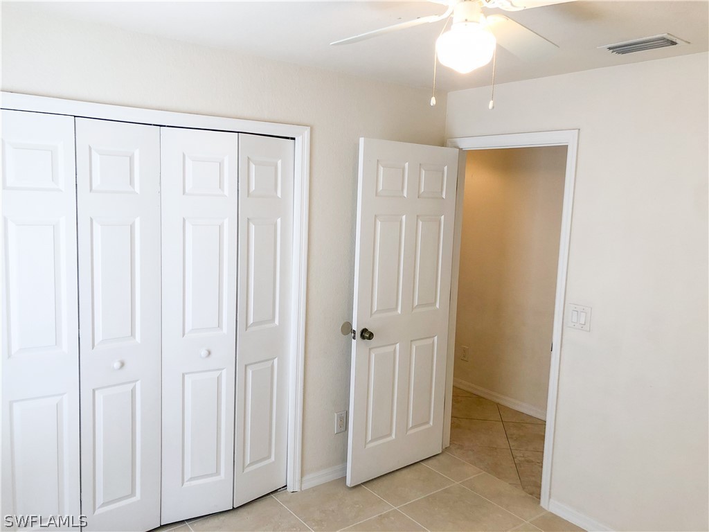 1823 Ridgemoor Street Lehigh Acres, FL 33972 - Photo 5 of 20 a view of a bathroom with a shower