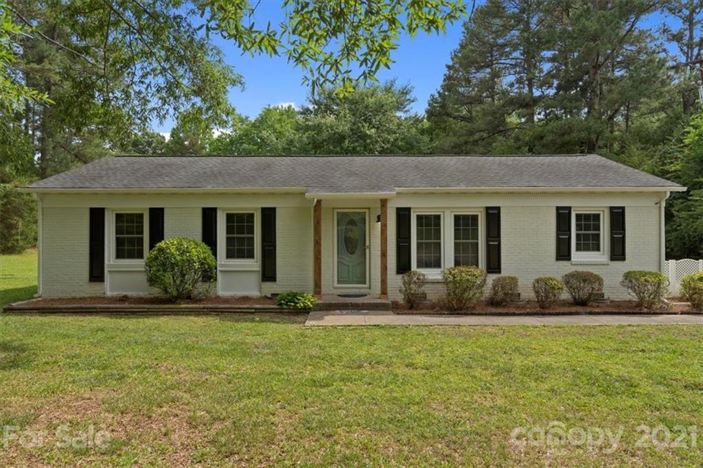 2665 Holbrook Road Fort Mill, SC 29715 - Photo 1 of 44 a front view of a house with a garden and porch