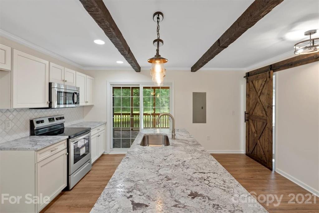 2665 Holbrook Road Fort Mill, SC 29715 - Photo 13 of 44 a kitchen with stainless steel appliances granite countertop a sink stove and refrigerator