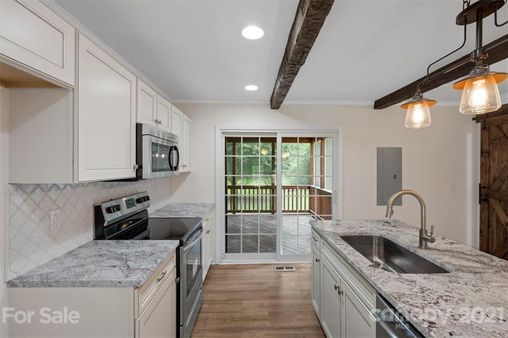 2665 Holbrook Road Fort Mill, SC 29715 - Photo 18 of 44 a kitchen with stainless steel appliances granite countertop a sink stove and refrigerator