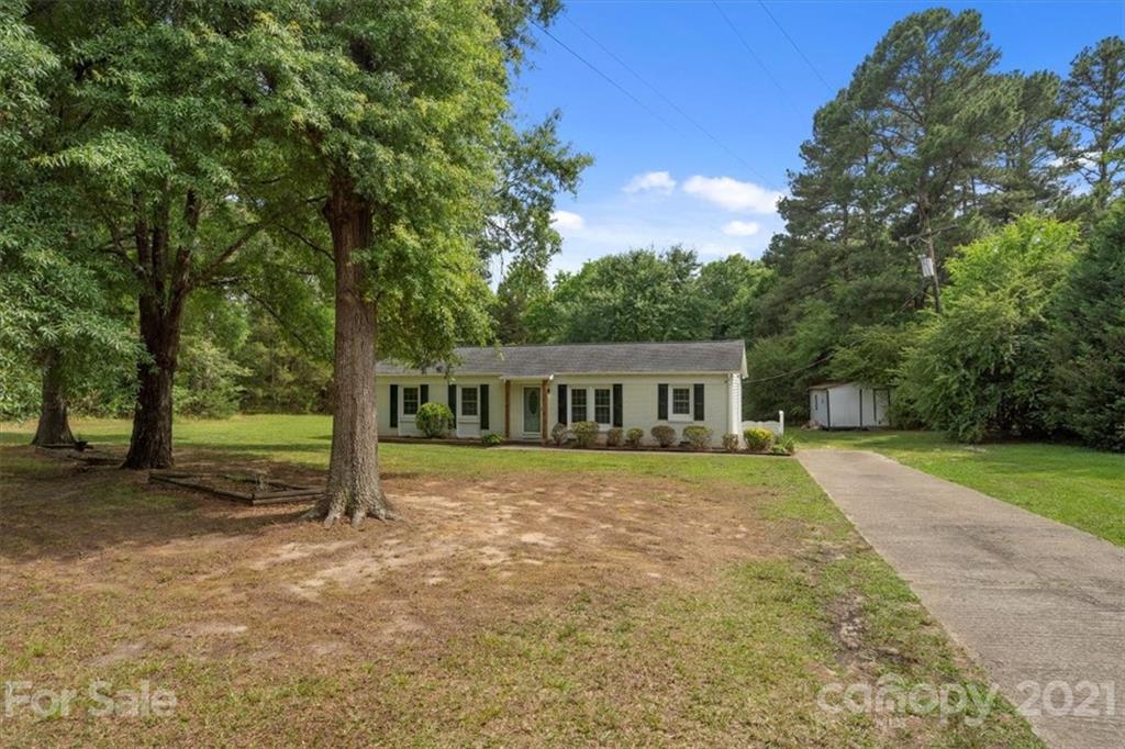 2665 Holbrook Road Fort Mill, SC 29715 - Photo 3 of 44 a house with trees in front of it