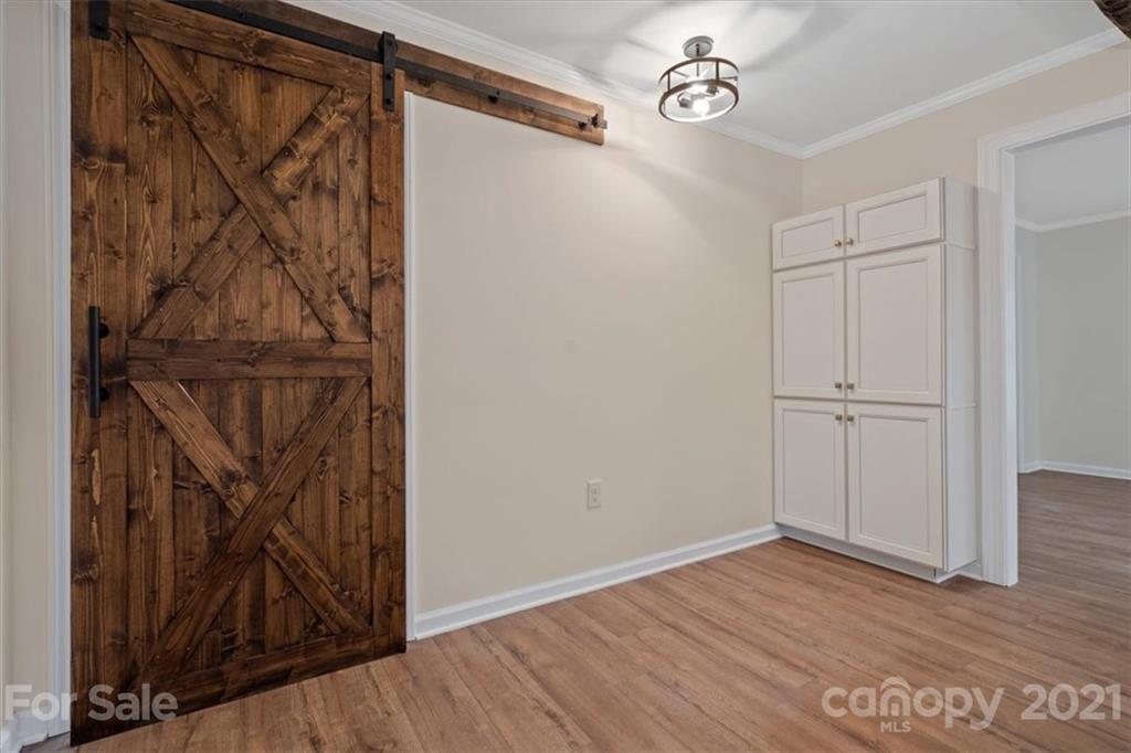 2665 Holbrook Road Fort Mill, SC 29715 - Photo 21 of 44 a view of a hallway with wooden floor and a shower