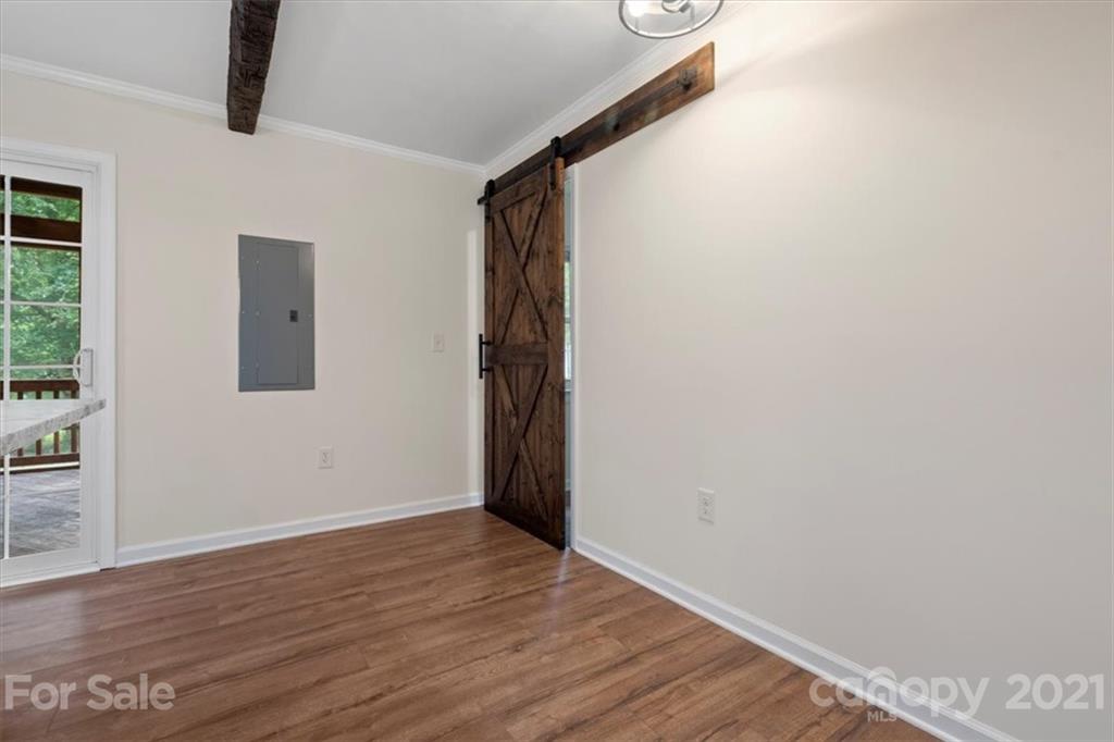 2665 Holbrook Road Fort Mill, SC 29715 - Photo 22 of 44 a view of an empty room with wooden floor and a window