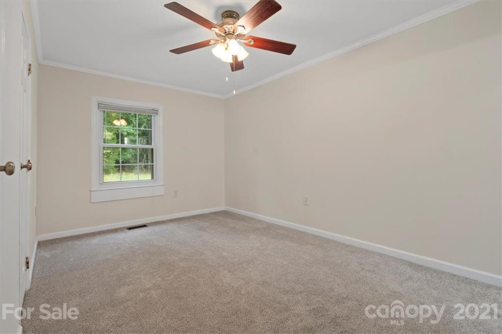 2665 Holbrook Road Fort Mill, SC 29715 - Photo 25 of 44 an empty room with a window and a fan