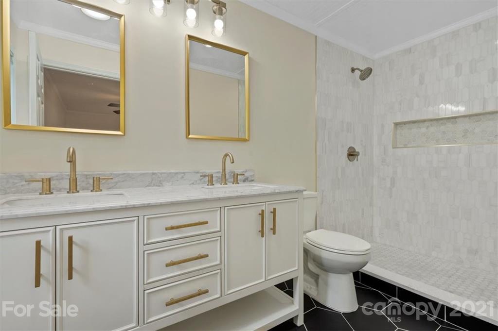 2665 Holbrook Road Fort Mill, SC 29715 - Photo 27 of 44 a bathroom with a granite countertop toilet sink and mirror