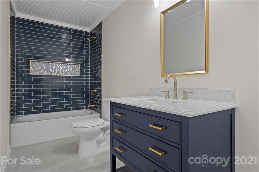 2665 Holbrook Road Fort Mill, SC 29715 - Photo 31 of 44 a bathroom with a sink a toilet and shower