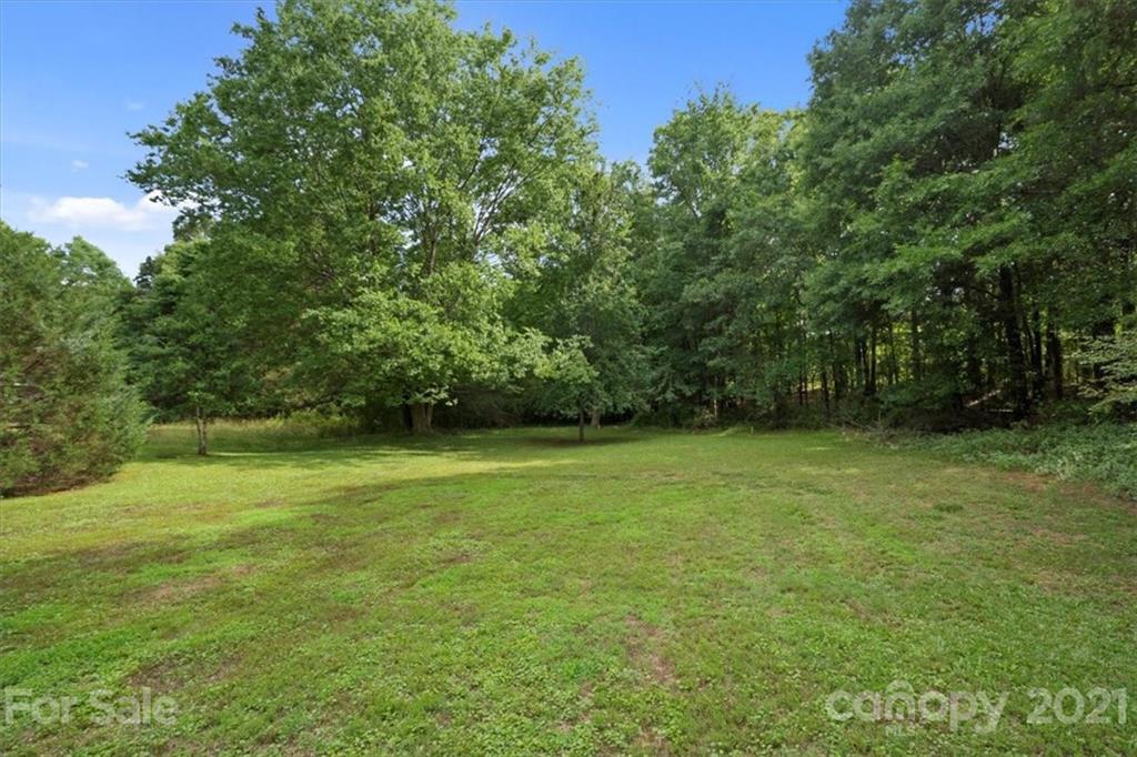 2665 Holbrook Road Fort Mill, SC 29715 - Photo 40 of 44 a view of a field with a trees