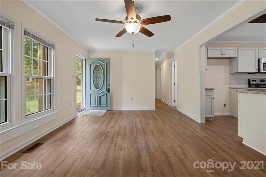 2665 Holbrook Road Fort Mill, SC 29715 - Photo 5 of 44 a view of empty room with wooden floor and fan