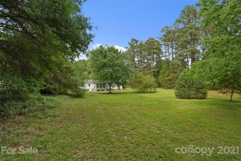 2665 Holbrook Road Fort Mill, SC 29715 - Photo 41 of 44 a view of a field of grass and trees