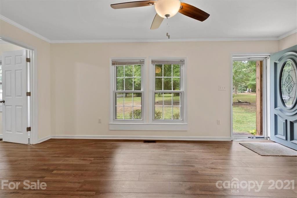 2665 Holbrook Road Fort Mill, SC 29715 - Photo 6 of 44 an empty room with wooden floor fan and windows