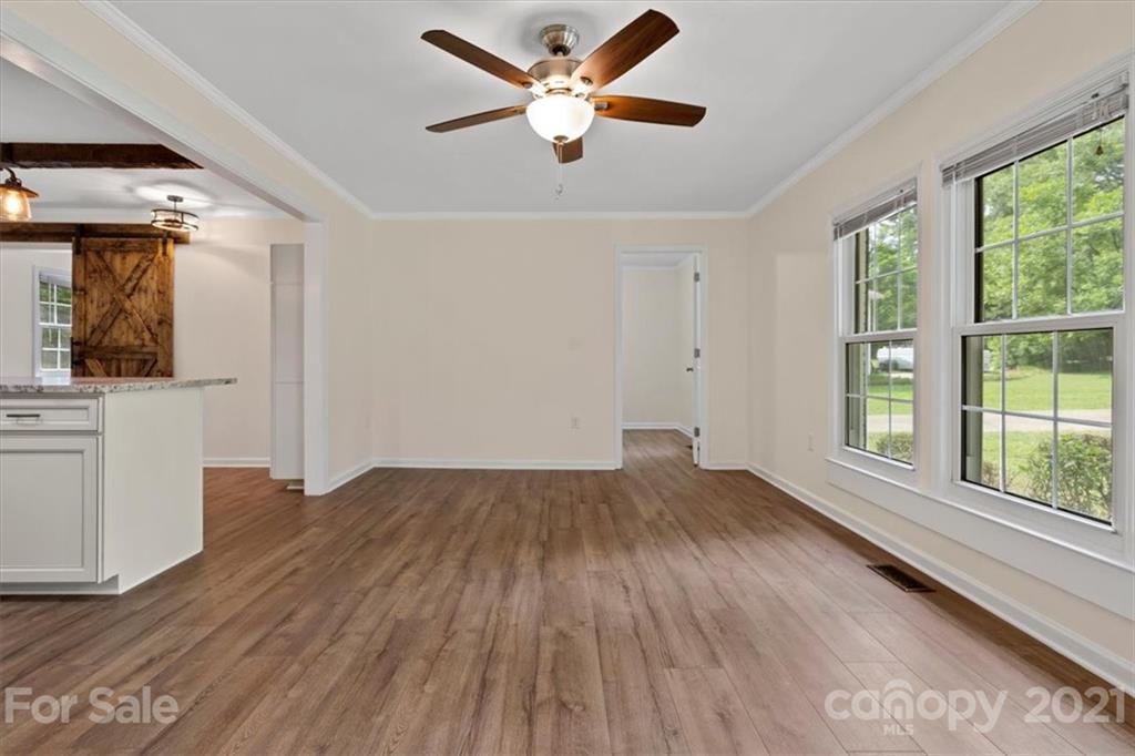 2665 Holbrook Road Fort Mill, SC 29715 - Photo 9 of 44 wooden floor in an empty room with a window