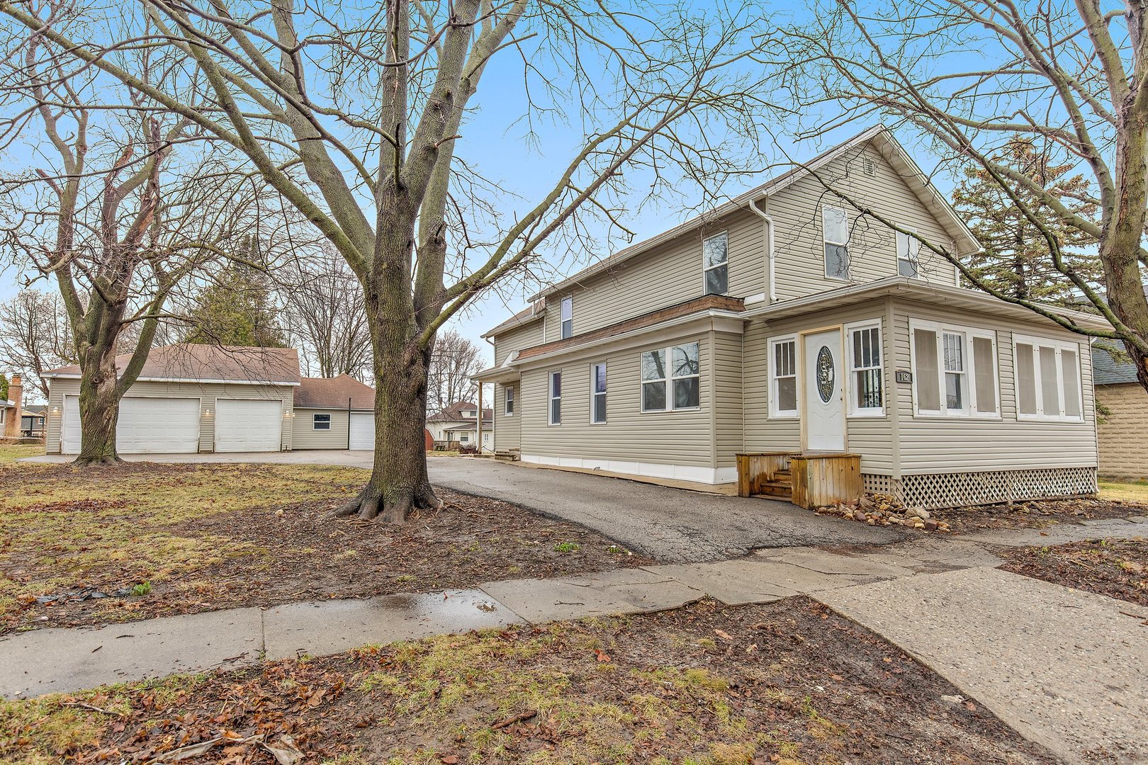 162 Park Street Hampshire, IL 60140 - Photo 25 of 25 a front view of a house with a yard covered in snow