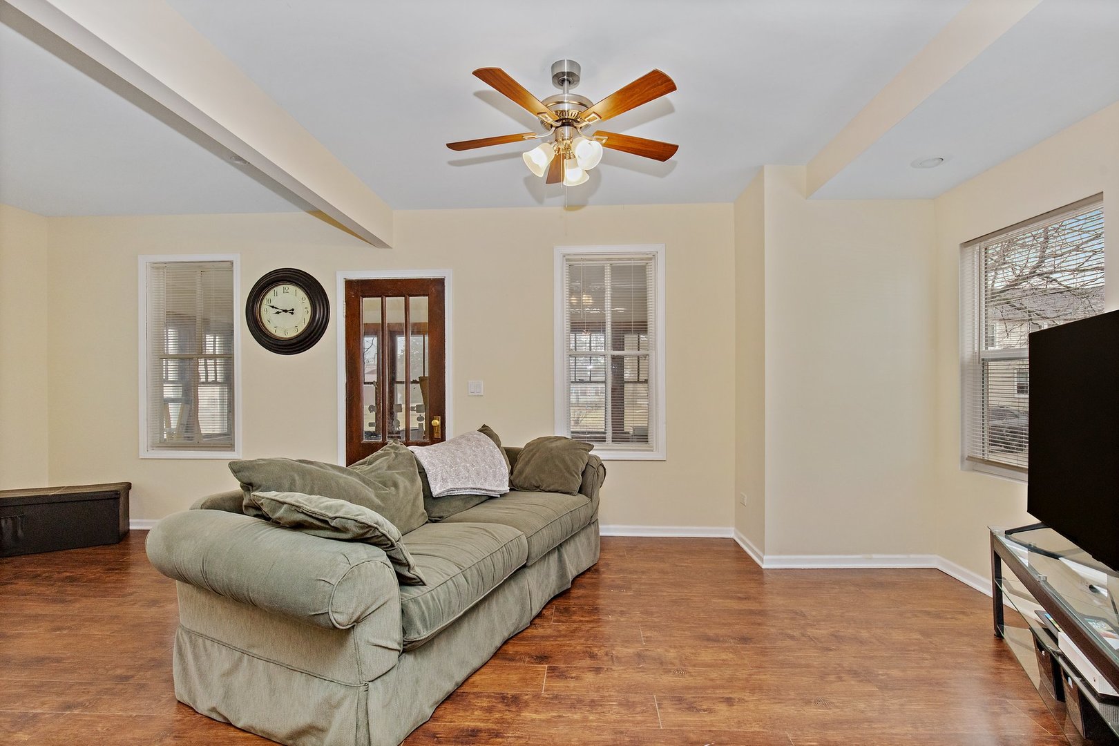 162 Park Street Hampshire, IL 60140 - Photo 5 of 25 a living room with couches a fireplace and a flat screen tv